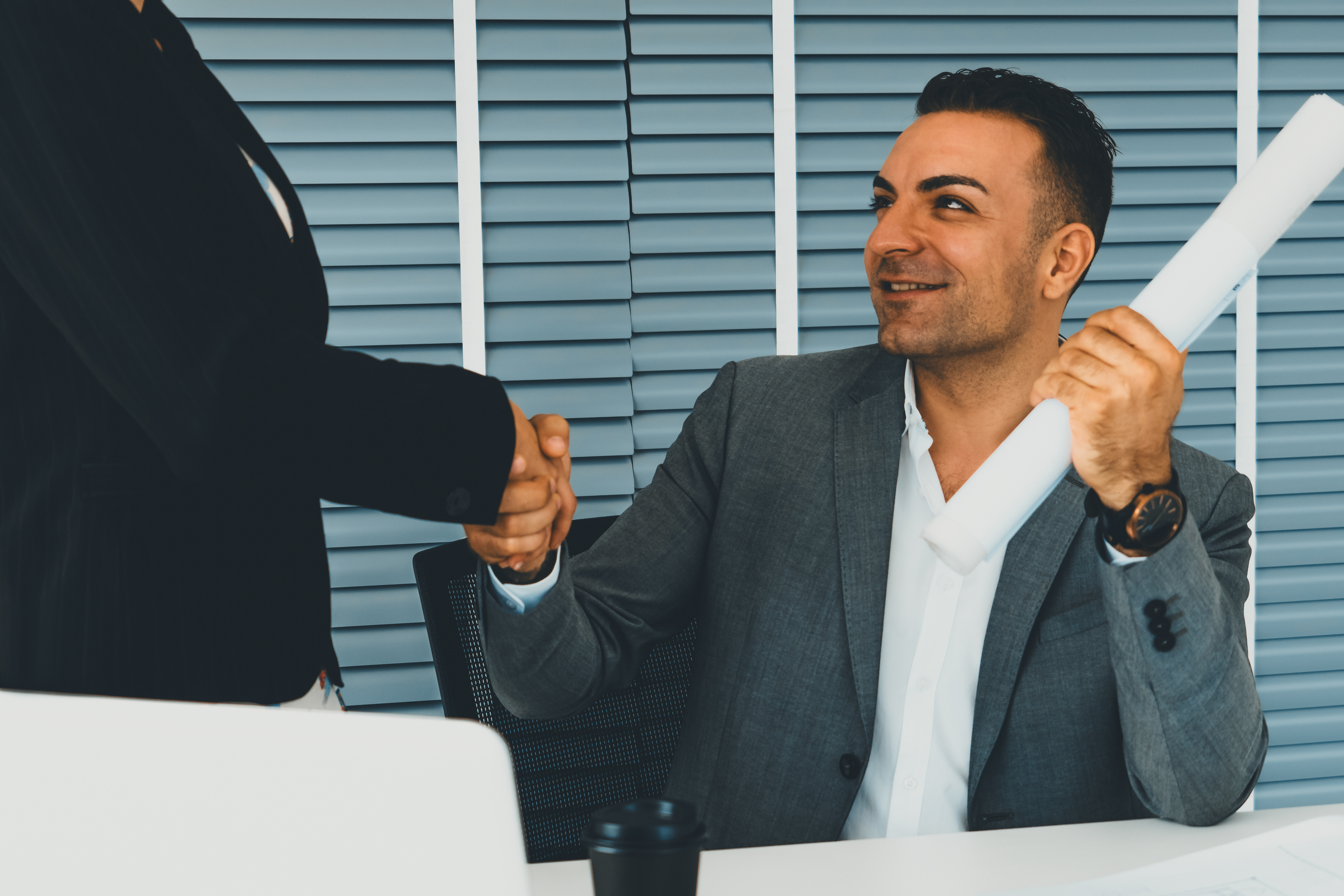 businessman-handshake-businesswoman-office-uds.jpg